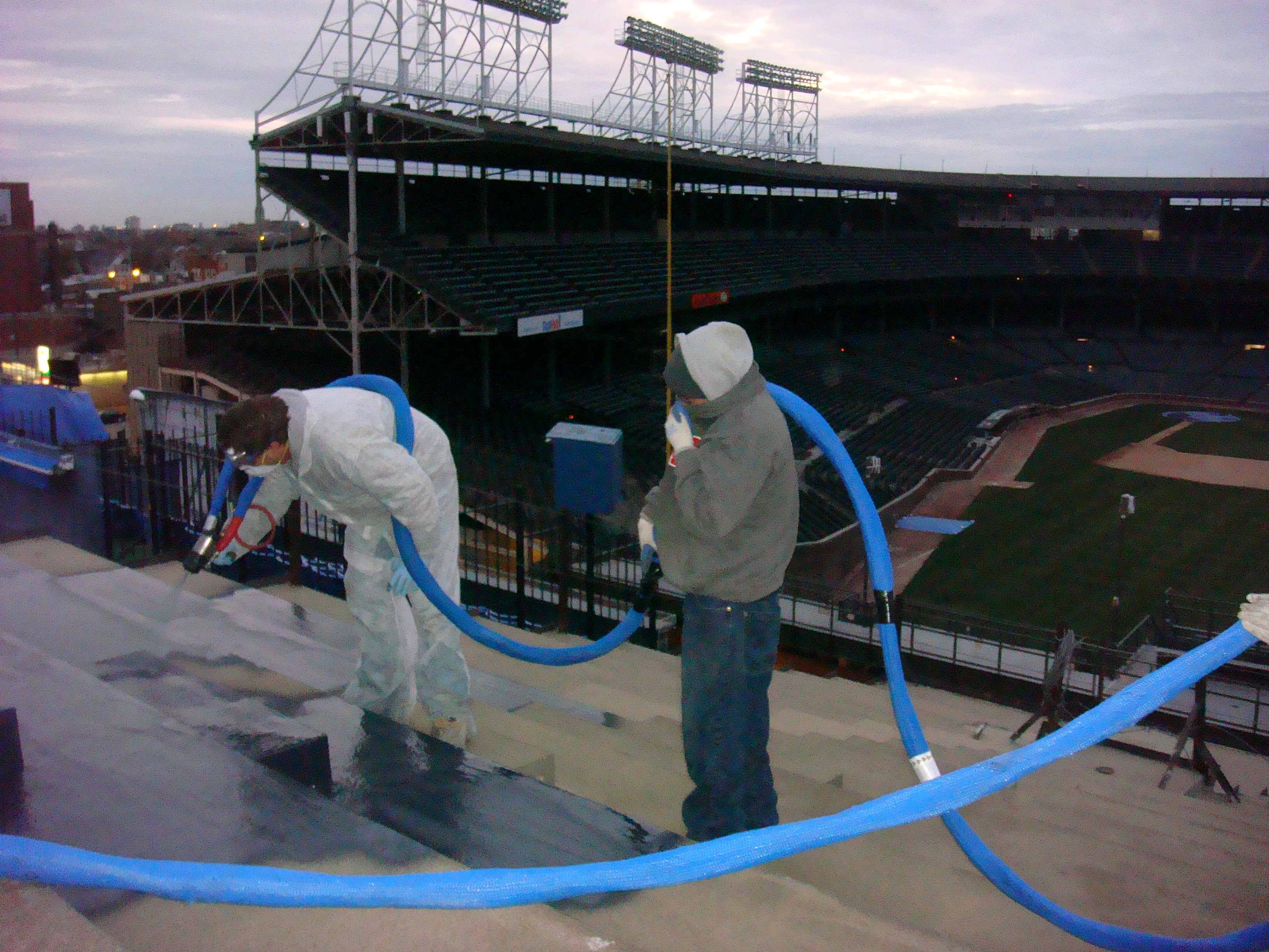 Mixed concrete and metal detail primed for a continuous coating