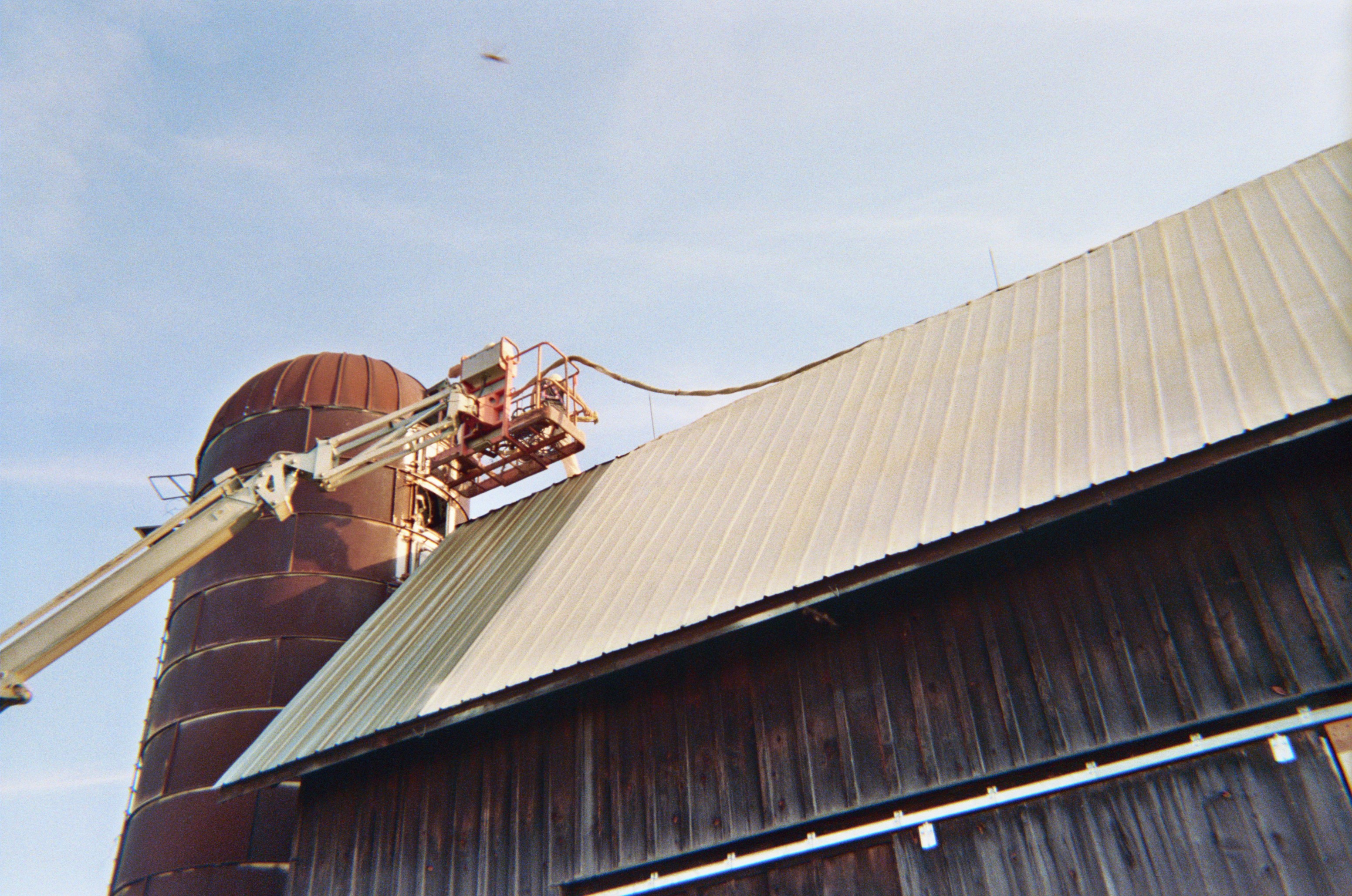 Agricultural metal barn roof primed and coated